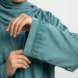 Close-up detail of Aqua Sky Turquoise DMC Abaya showcasing turquoise DMC stones