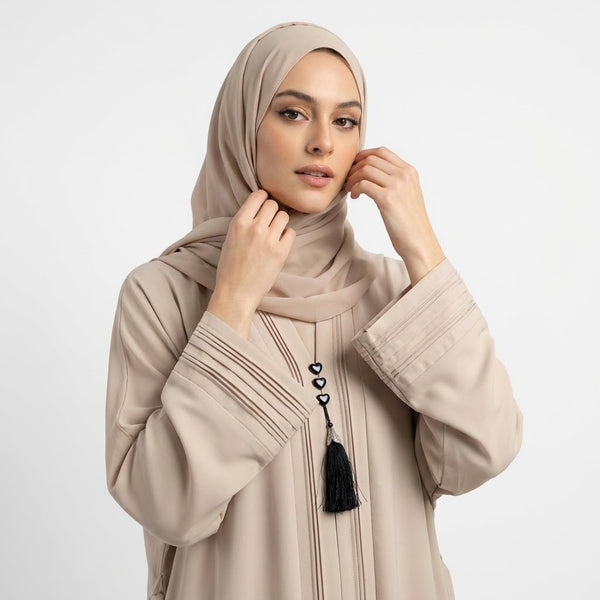 Front view of Champagne Beige Pintuck Panel Gown - premium TikTok fabric closed abaya