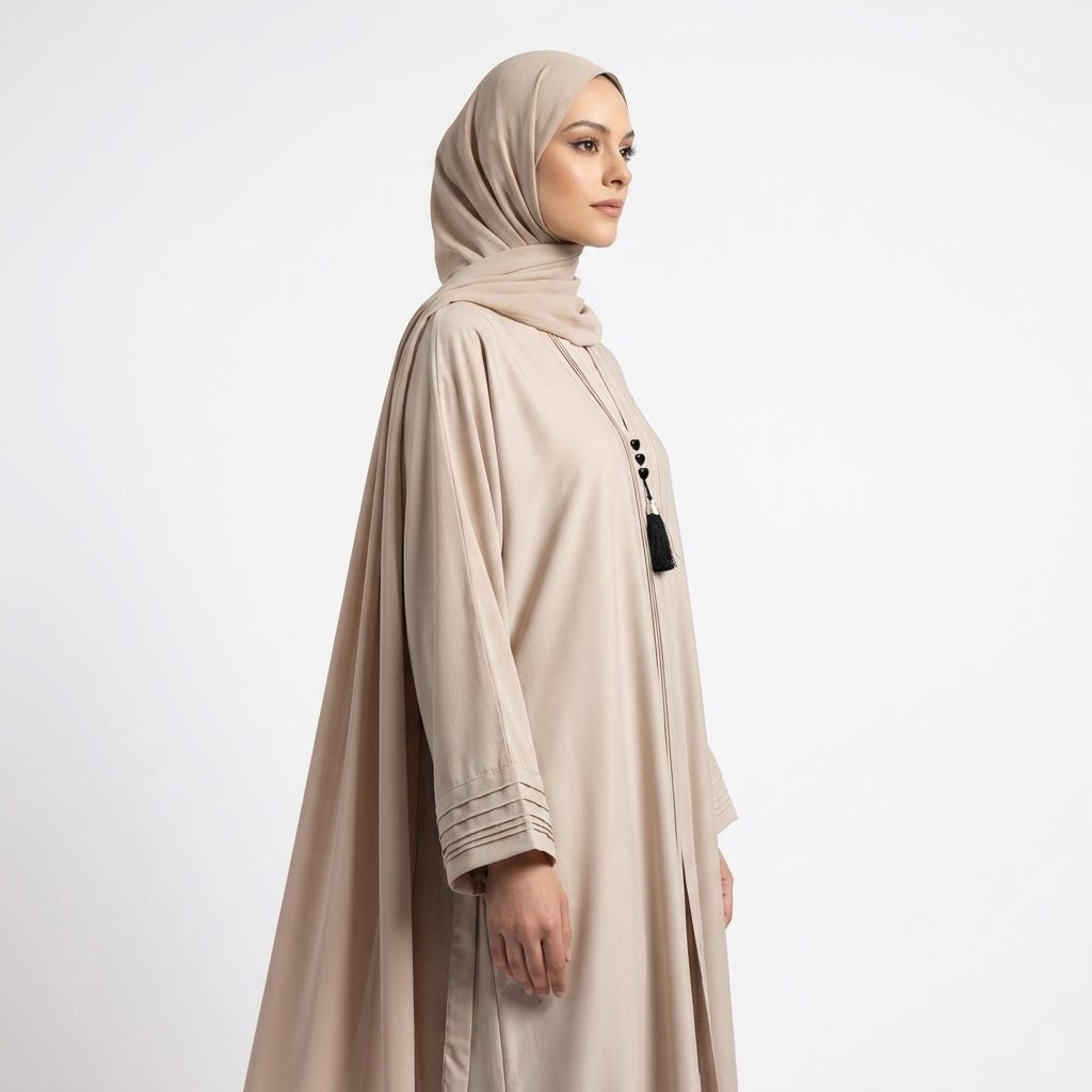 Full length styled look of Champagne Beige Pintuck Panel Gown with waist tie belt