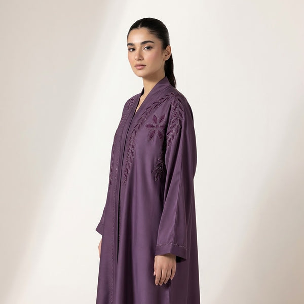 Side profile of Luminous Embellished Coat highlighting the silhouette