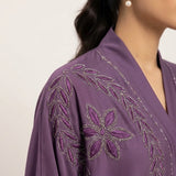 Full-length view of Luminous Embellished Coat in Dusty Mauve / Muted Purple with Tone-on-Tone Thread Embroidery & Silver DMC Rhinestone Accents