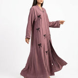 Side profile of Mauve Ribbon Abaya highlighting the silhouette