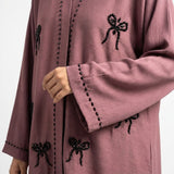 Styled look of Mauve Ribbon Abaya, perfect for * formal gatherings, festive occasions, evening wear, or chic everyday modest fashion. * *care instructions:* dry clean or gentle hand wash in cold water only; hang to dry to protect hand-beaded details