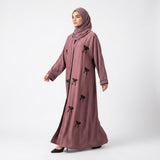 Full-length view of Mauve Ribbon Abaya in signature colorway