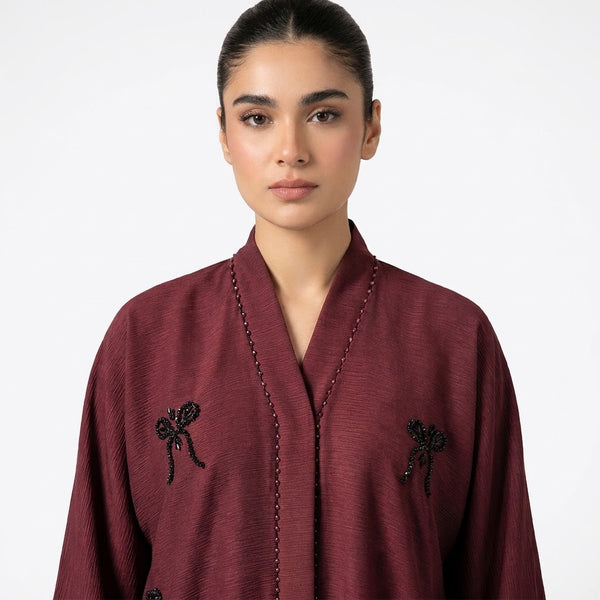 Close-up detail of Hand-Crafted Cut-Dana Bow Abaya 2 showcasing the design work