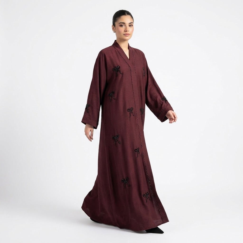 Side profile of Hand-Crafted Cut-Dana Bow Abaya 2 highlighting the silhouette