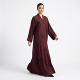 Side profile of Hand-Crafted Cut-Dana Bow Abaya 2 highlighting the silhouette