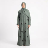 Side profile of Hand-Crafted Cut-Dana Bow Coat highlighting the silhouette