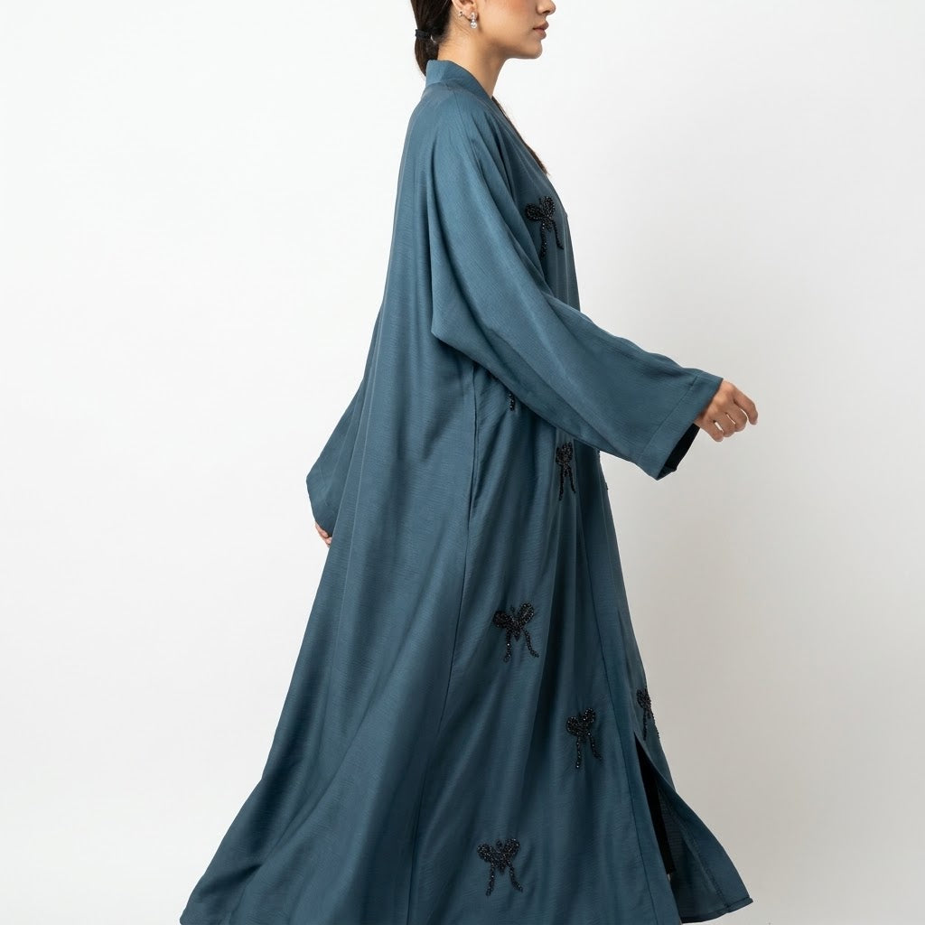 Styled look of Steel Hand-Crafted Cut-Dana Bow Coat, perfect for semi-formal gatherings, festive events, boutique wear, and high-end modest fashion