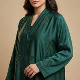 Side profile of Emerald Crystal Tulip Coat highlighting the silhouette