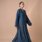 Side profile of Peacock Crystal Tulip Coat highlighting the silhouette