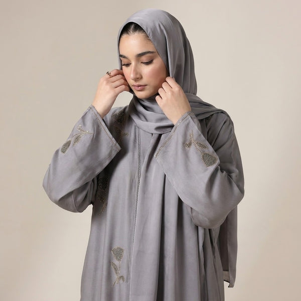 Gold and gunmetal DMC crystal tulip detail on steel grey abaya