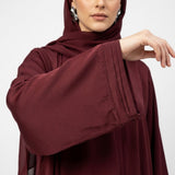 Close-up detail of Deep Maroon Pintuck Panel Gown showcasing vertical panel pintucks and heart studs