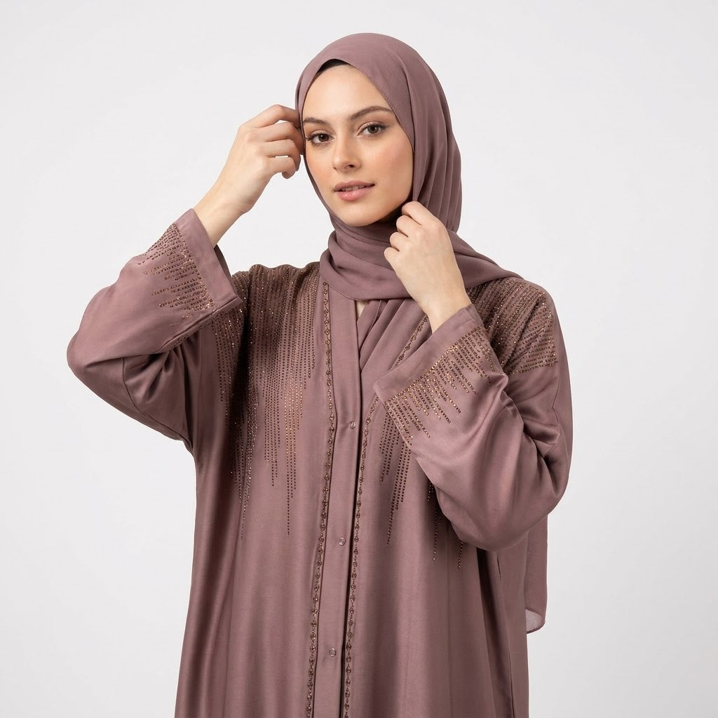 Close-up detail of Dusty Mauve DMC Cascade Abaya showcasing golden-bronze DMC stones