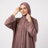 Close-up detail of Dusty Mauve DMC Cascade Abaya showcasing golden-bronze DMC stones