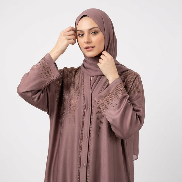 Close-up detail of Dusty Mauve DMC Cascade Abaya showcasing golden-bronze DMC stones