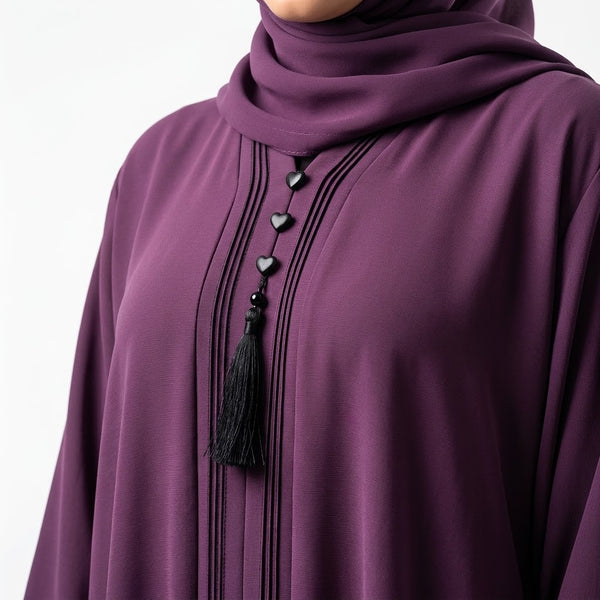 Close-up detail of Deep Plum Pintuck Panel Gown showcasing vertical panel pintucks and heart studs