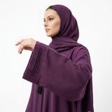 Styled look of Deep Plum Pintuck Panel Gown with waist tie belt