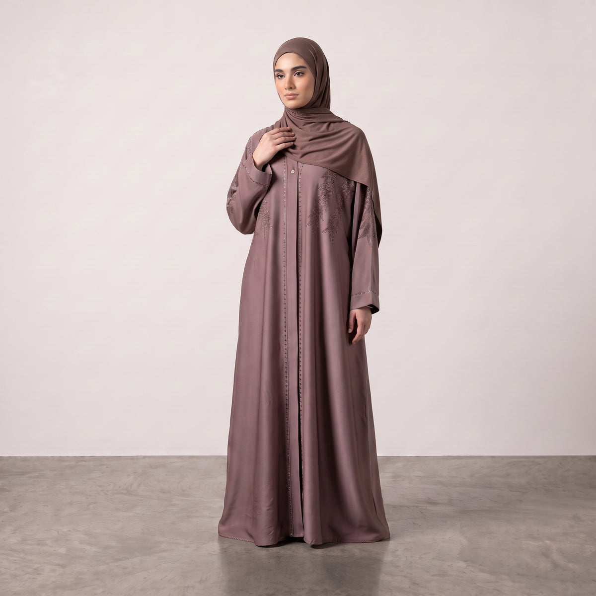 Front standing view of Dusty Rose Feather Abaya