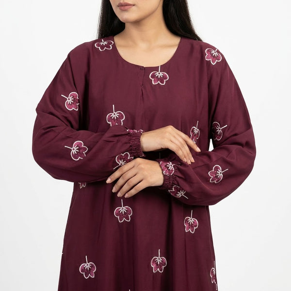 Close-up detail of Maroon Botanical Floral Gown showcasing the design work