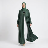 Close-up detail of Emerald Pin-Tuck 2-in-1 Abaya showcasing pin-tuck pleats and heart charm