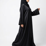 Close-up detail of Jet Black Tassel Coat Abaya showcasing tassel and bead accent