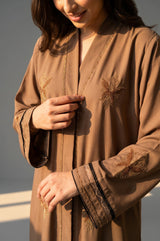 Styled front view of Latte Botanical Open Abaya with tonal embroidery