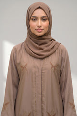Sleeve detail of Latte Botanical Open Abaya showing contrast black lace cuffs
