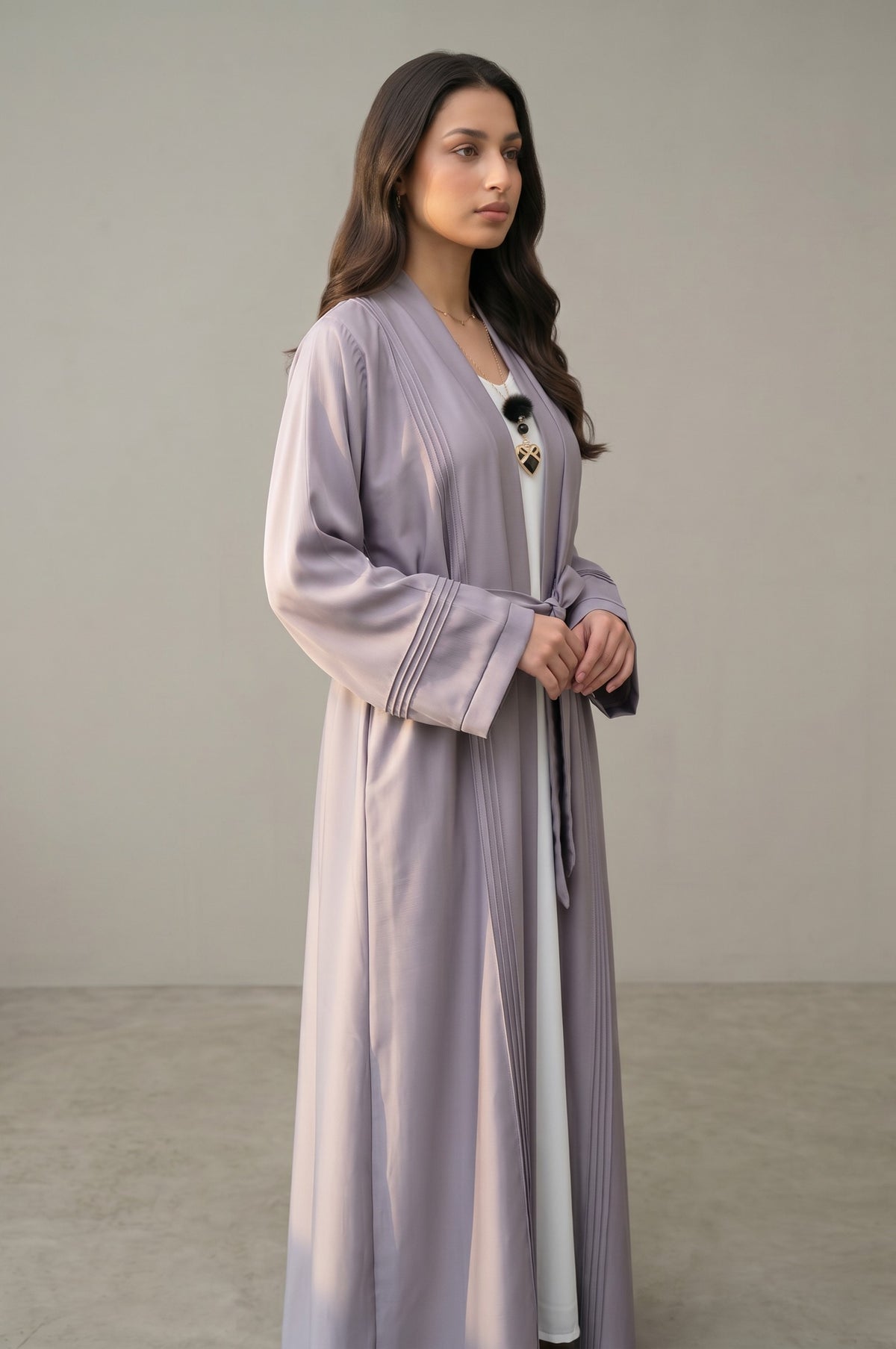Side profile of Luna Pleated Abaya highlighting the silhouette