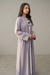 Side profile of Luna Pleated Abaya highlighting the silhouette