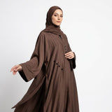 Close-up detail of Mocha Brown Teardrop Studded Coat showcasing pintucks and teardrop studs