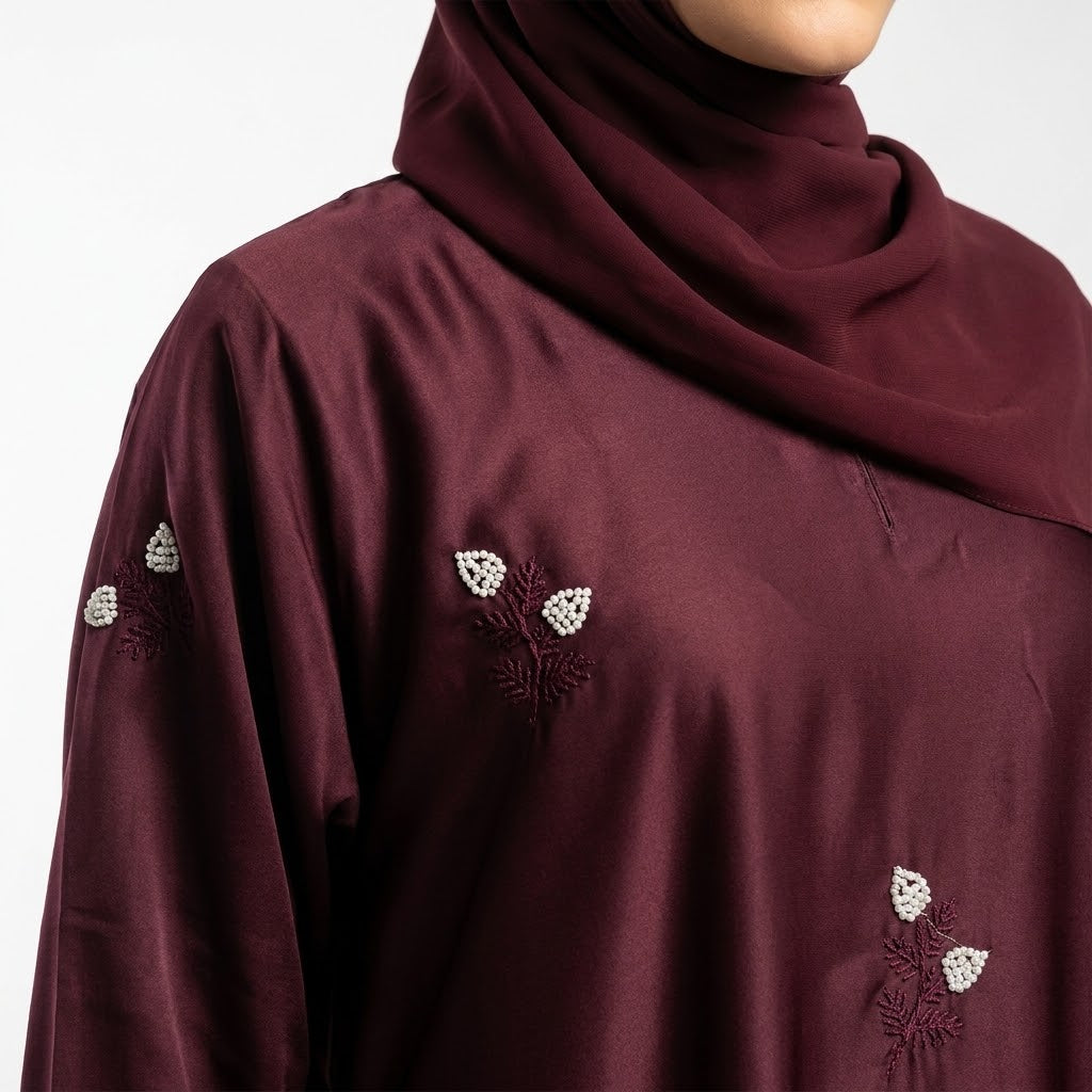 Close-up of Maroon Floral Sprig Nida Gown showcasing off-white floral sprig embroidery