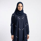 Close-up of Navy Floral Sprig Nida Gown showcasing white floral sprig embroidery