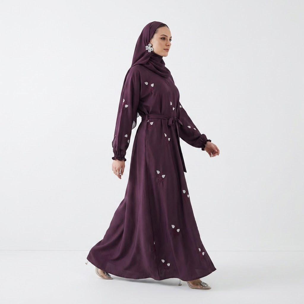 Close-up of Plum Floral Sprig Nida Gown showcasing off-white floral sprig embroidery