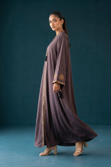 Styled front view of Dusty Plum Celestial Abaya with sunburst sleeve embroidery