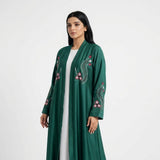 Full-length view of Crimson Flora Paisley Coat in Deep Emerald Green base with Crimson Pink, Off-White, and Tonal Green thread embroidery