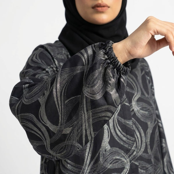 Side profile of Silver Wave Swirl Coat highlighting the silhouette