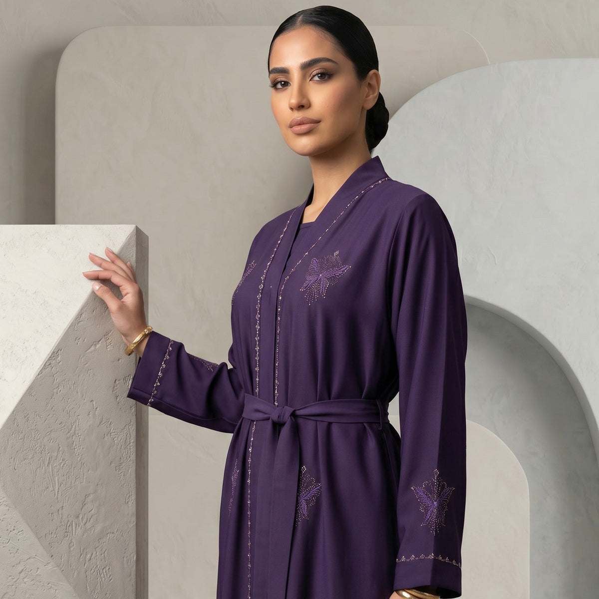Close-up detail of butterfly geometric embroidery on Regal Eggplant Belted Abaya