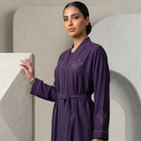 Close-up detail of butterfly geometric embroidery on Regal Eggplant Belted Abaya