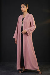Close-up detail of Dusty Rose Pleated Brooch Abaya showcasing metallic brooch hardware