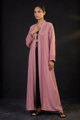 Side view of Dusty Rose Pleated Brooch Abaya showing black inner layer contrast