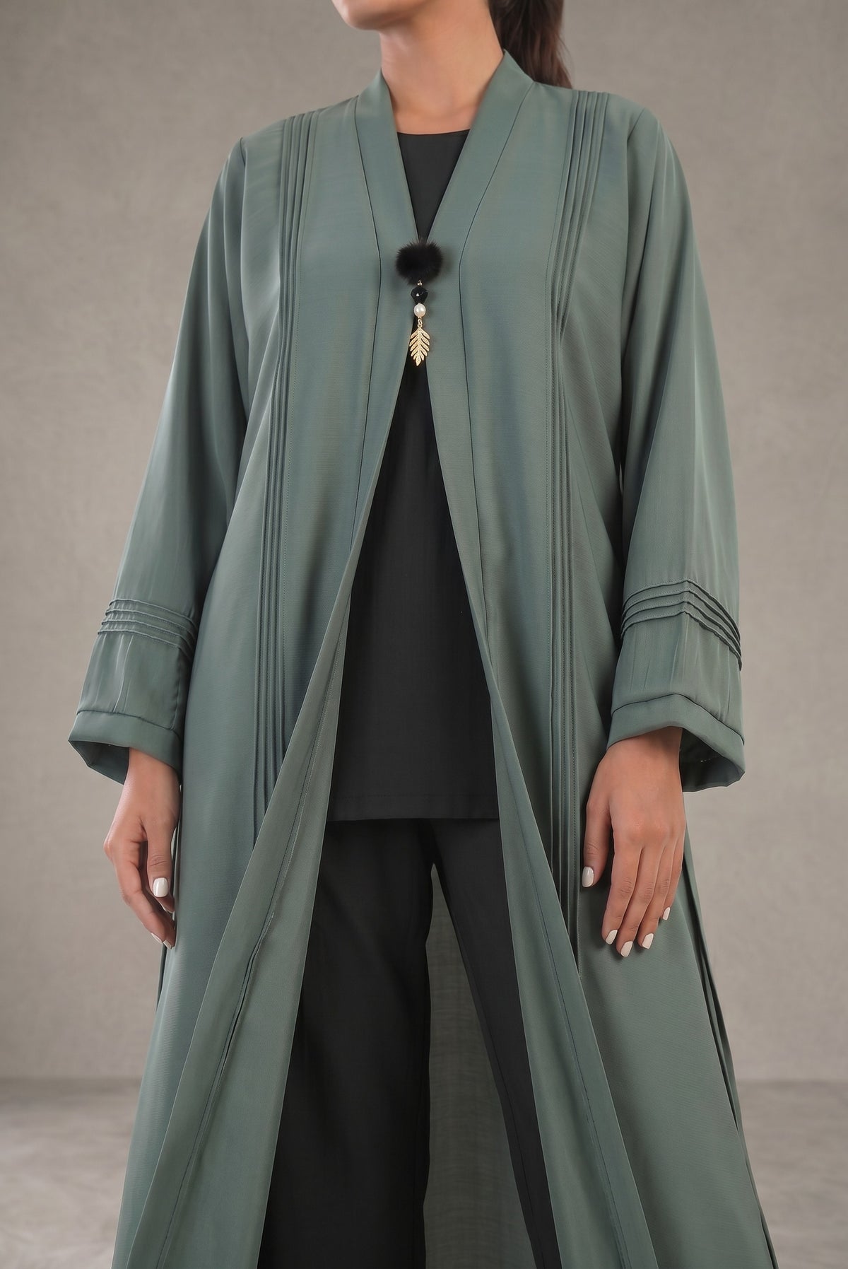 Front view of Sage Green Pleated Buckle Abaya - premium TikTok fabric pre-layered abaya