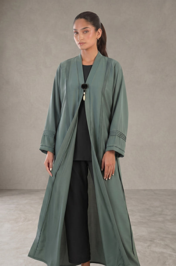 Styled front view of Sage Green Pleated Buckle Abaya showing vertical pintuck pleats