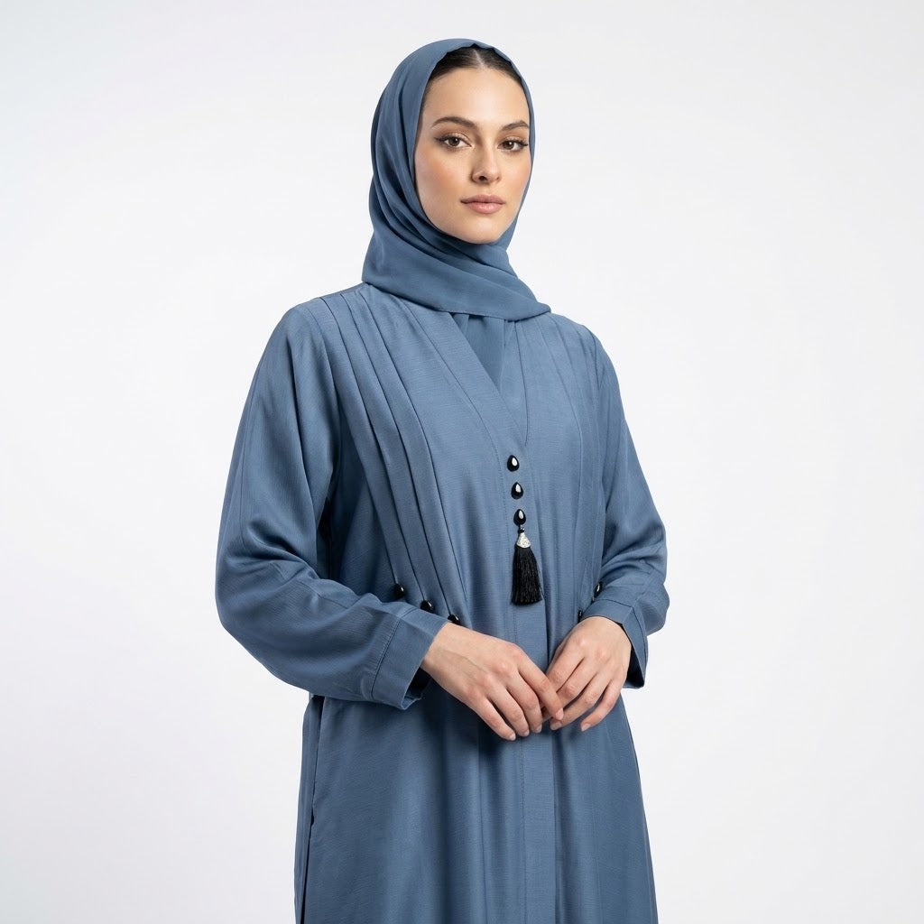 Pintucks and teardrop stud detail on slate blue abaya