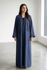 Full-length view of Feather Rhinestone Deep Abaya in Shade: A rich, majestic Midnight Navy Blue
