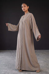Side view of Taupe Glow Embellished Abaya showing luminous drape