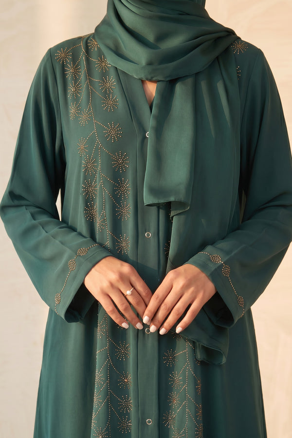 Close-up detail of Emerald Rhinestone Starburst Abaya showcasing the design work