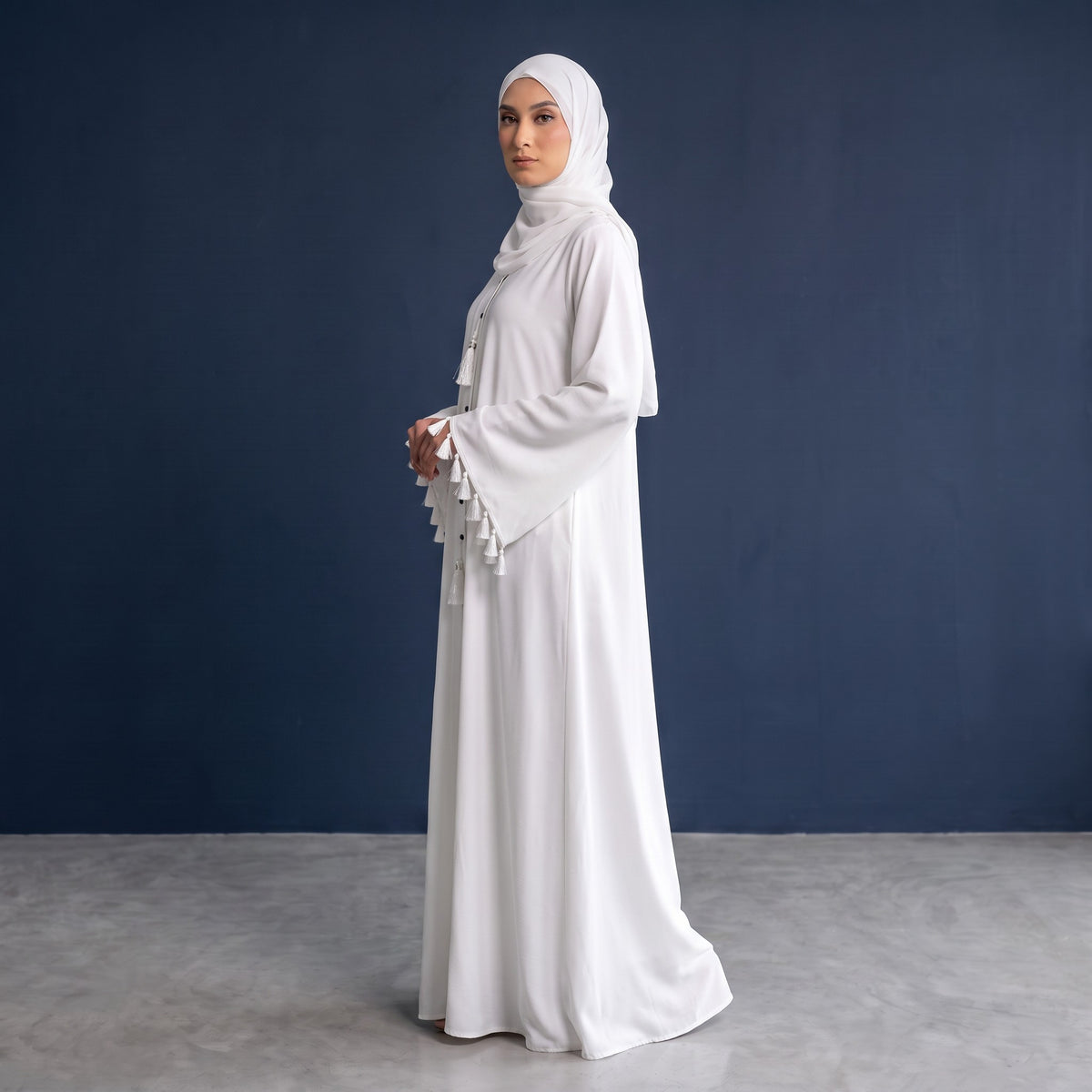 Side profile of Pearl Tassel Flared Abaya highlighting the silhouette