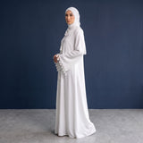 Side profile of Pearl Tassel Flared Abaya highlighting the silhouette