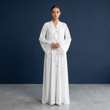 Styled look of Pearl Tassel Flared Abaya, perfect for formal events, festive celebrations, summer gatherings, and religious wear (umrah/hajj). discount naad cut prices : 6300 is the actual price and the cut peice is 4400 ( off 30% )